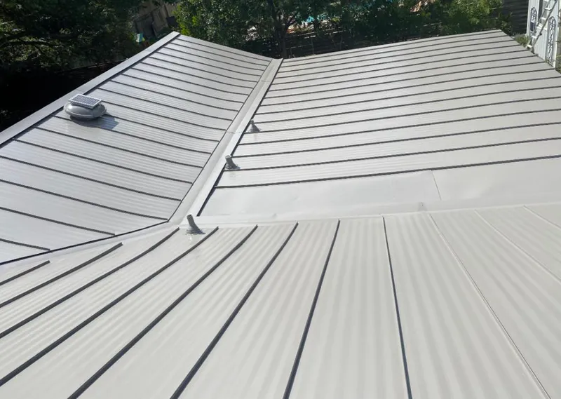 Solar attic fan installed on a metal roof for Roof Ventilation in Immokalee